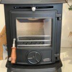 Modern wood-burning stove installation in a cosy residential setting