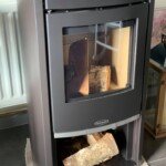 Modern wood-burning stove installation in a cosy residential setting