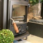 Modern wood-burning stove installation in a cosy residential setting